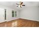 Spacious living room with hardwood floors, fan, and natural light at 2805 Evans St, Durham, NC 27705
