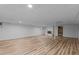 Spacious finished basement with wood flooring and a cozy fireplace at 307 Yowland Rd, Henderson, NC 27536