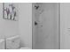 Updated bathroom features marble shower, modern fixtures, and white tile at 307 Yowland Rd, Henderson, NC 27536