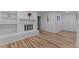 Living room with a white brick fireplace and modern floors at 307 Yowland Rd, Henderson, NC 27536