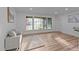 Inviting living room featuring a large window providing ample natural light and cozy seating at 307 Yowland Rd, Henderson, NC 27536