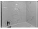Close up of bathroom featuring stylish tile and updated shower head at 307 Yowland Rd, Henderson, NC 27536