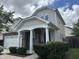 Beautiful home featuring a covered porch with classic white columns and manicured landscaping at 3124 Mackinac Island Ln, Raleigh, NC 27610