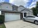 Charming two-story home featuring a two-car garage, stone accents, and classic architectural design at 3124 Mackinac Island Ln, Raleigh, NC 27610