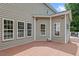 Back deck features muted-green siding and a gray roof at 3208 Wilbon Ridge Dr, Holly Springs, NC 27540