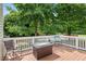 Cozy outdoor deck with table, chairs and lots of shade from mature trees at 3208 Wilbon Ridge Dr, Holly Springs, NC 27540