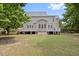 Expansive backyard featuring a large wooden deck, perfect for entertaining and outdoor relaxation at 3208 Wilbon Ridge Dr, Holly Springs, NC 27540