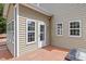 Back porch with wooden floors and muted-green siding at 3208 Wilbon Ridge Dr, Holly Springs, NC 27540
