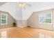 Bright bedroom featuring hardwood floors, neutral walls, and lots of natural light at 3208 Wilbon Ridge Dr, Holly Springs, NC 27540