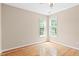 Empty bedroom featuring natural light, hard wood floors, and neutral paint at 3208 Wilbon Ridge Dr, Holly Springs, NC 27540