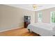 Bright bedroom with a ceiling fan, and two windows allowing for ample natural light at 3208 Wilbon Ridge Dr, Holly Springs, NC 27540