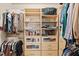 Walk-in closet featuring lots of organizational shelving and hanging space at 3208 Wilbon Ridge Dr, Holly Springs, NC 27540