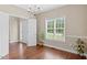 Dining area featuring hardwood floors and a chandelier, ideal for entertaining at 3208 Wilbon Ridge Dr, Holly Springs, NC 27540