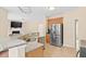 Well-lit kitchen with granite countertops, stainless steel appliances, and ample counter space at 3208 Wilbon Ridge Dr, Holly Springs, NC 27540
