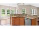 Bright kitchen with granite countertops, modern appliances, and ample natural light at 3208 Wilbon Ridge Dr, Holly Springs, NC 27540