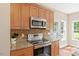 Well-appointed kitchen featuring granite countertops and stainless steel appliances at 3208 Wilbon Ridge Dr, Holly Springs, NC 27540