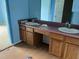 Bathroom featuring a double sink vanity and light blue wall paint at 3213 Sam Usry Rd, Oxford, NC 27565