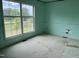 Bedroom featuring a large window and carpeted flooring at 3213 Sam Usry Rd, Oxford, NC 27565