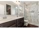 Modern bathroom boasts a double vanity and a walk-in shower with marble-style tiling at 34 Tanglewood Pl, Angier, NC 27501