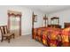 Elegant bedroom featuring a four-poster bed, matching furniture, and natural light at 34 Tanglewood Pl, Angier, NC 27501