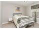 Cozy bedroom featuring a bed with soft lighting and a minimalist aesthetic at 34 Tanglewood Pl, Angier, NC 27501