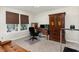 Office space with natural light, ample desk space, and an armoire for storage at 34 Tanglewood Pl, Angier, NC 27501