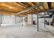 Awaiting customization, the unfinished basement features exposed beams and concrete flooring at 3404 Mount Pisgah Way, Cary, NC 27519