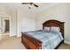 Relaxing bedroom showcasing a wood-framed bed with soft blue comforter and carpeted floors at 3404 Mount Pisgah Way, Cary, NC 27519