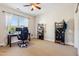 Office space in bedroom with desk, shelving, and natural light from a large window at 3404 Mount Pisgah Way, Cary, NC 27519