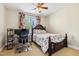 A bedroom featuring a ceiling fan, floral bedspread and drapes at 3404 Mount Pisgah Way, Cary, NC 27519