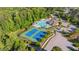Aerial view showcases community pool, tennis courts, landscaping, and building amenities at 3404 Mount Pisgah Way, Cary, NC 27519