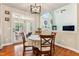 A dinette set sits in front of the glass doors leading to the deck at 3404 Mount Pisgah Way, Cary, NC 27519