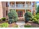 Inviting front entrance with double doors, manicured bushes and a brick walkway, creating a warm welcome at 3404 Mount Pisgah Way, Cary, NC 27519