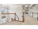 An upstairs hallway with carpet and chandelier at 3404 Mount Pisgah Way, Cary, NC 27519