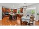 Gourmet kitchen with granite countertops, stainless steel appliances, and a bright breakfast nook at 3404 Mount Pisgah Way, Cary, NC 27519