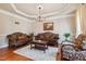 Formal living room featuring elegant furniture, neutral paint and a decorative tray ceiling at 3404 Mount Pisgah Way, Cary, NC 27519