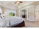 Bright main bedroom boasts tray ceilings, ceiling fan and an adjacent office at 3404 Mount Pisgah Way, Cary, NC 27519