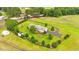 Charming home with circle driveway and manicured grounds with mature trees and outbuilding at 360 Country Way, Sanford, NC 27332