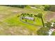 Expansive property with pond and single story home with circle drive and mature landscaping at 360 Country Way, Sanford, NC 27332