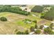 A single story home on sprawling acreage with circle drive, mature trees and stocked pond at 360 Country Way, Sanford, NC 27332