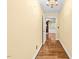 Inviting foyer with wood flooring and view into the cozy living room with fireplace at 360 Country Way, Sanford, NC 27332