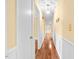 Hallway with hardwood floors, neutral walls, and beautiful white trim and doors at 360 Country Way, Sanford, NC 27332