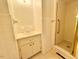 Tiled bathroom with a shower stall and a sink with storage cabinet at 3716 Rivermont Rd, Durham, NC 27712