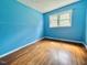 Bright bedroom with laminate floors and double windows allowing ample sunlight at 3716 Rivermont Rd, Durham, NC 27712