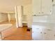 Bright eat-in kitchen boasts white cabinets and a spacious layout at 3716 Rivermont Rd, Durham, NC 27712