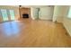 Spacious living area featuring laminate floors and doors to the backyard at 3716 Rivermont Rd, Durham, NC 27712