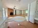 Spacious living area featuring laminate floors and a cozy brick fireplace at 3716 Rivermont Rd, Durham, NC 27712