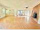 Spacious living area featuring laminate floors and a cozy brick fireplace at 3716 Rivermont Rd, Durham, NC 27712