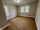 Bright bedroom featuring hardwood floors and natural light at 3804 Cobb St, Garner, NC 27529