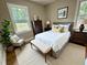 Inviting bedroom featuring a comfortable bed, stylish furniture, and natural light at 3804 Cobb St, Garner, NC 27529